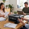 A lifestyle photo of a man inserting the black ink cartridge into a Brother printer in a bright home office.