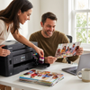 A lifestyle photo showing a couple happily printing family photos in a home office using the Balloon Brand LC3013XL Magenta ink cartridge.