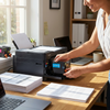 A woman smiles while inserting the cyan Balloon Brand LC3013XL ink cartridge into a Brother printer in a bright home office.